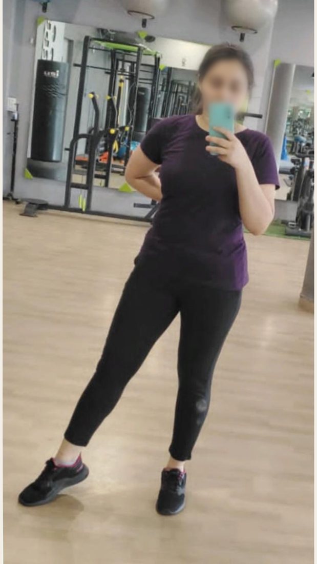 After photo from a client fitness transformation, face softly blurred for privacy