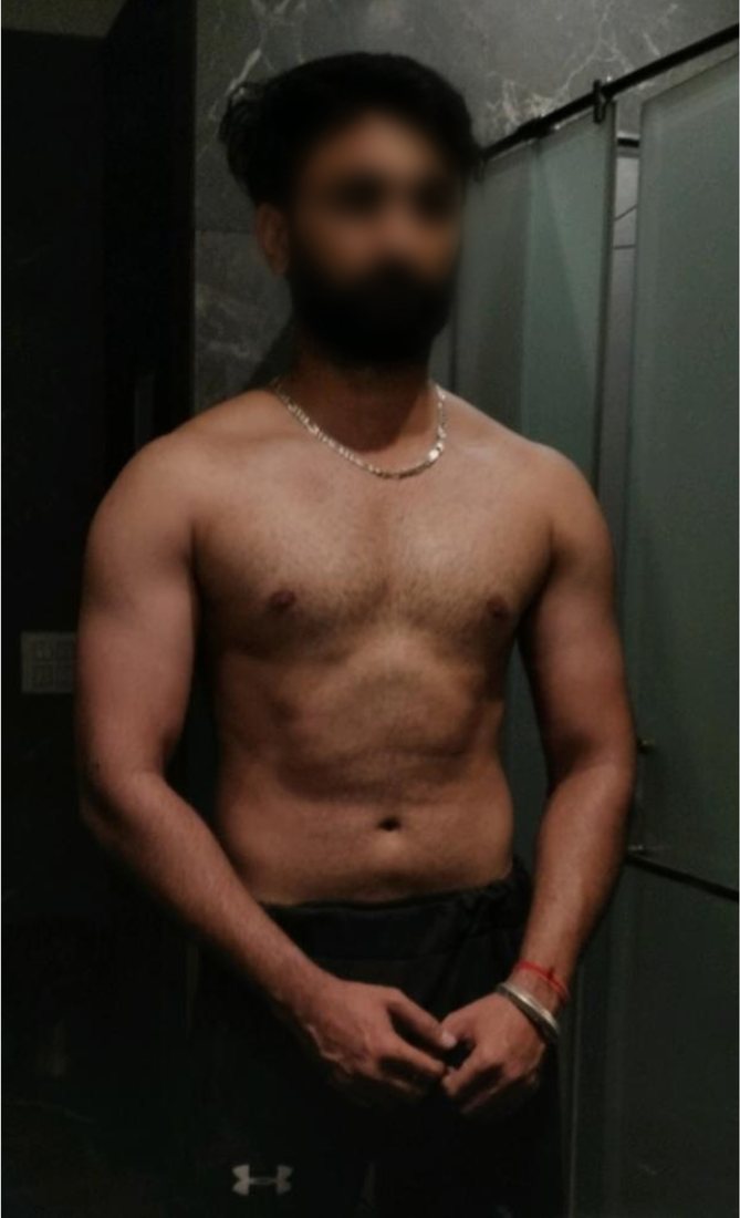 After photo from a client fitness transformation, face softly blurred for privacy