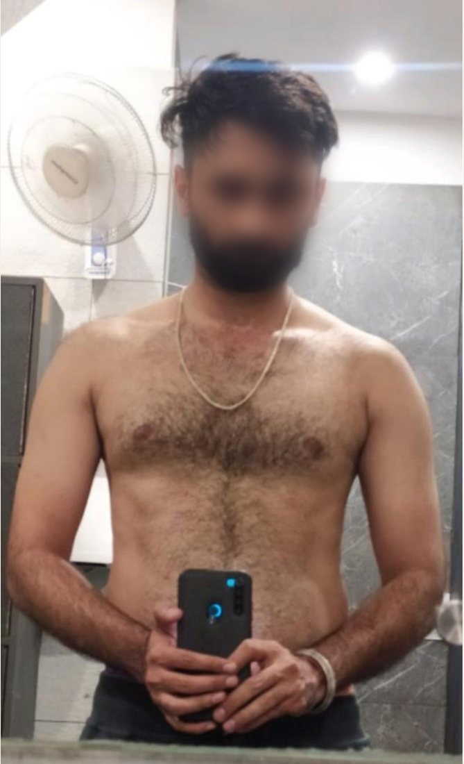 Before photo from a client fitness transformation, face softly blurred for privacy