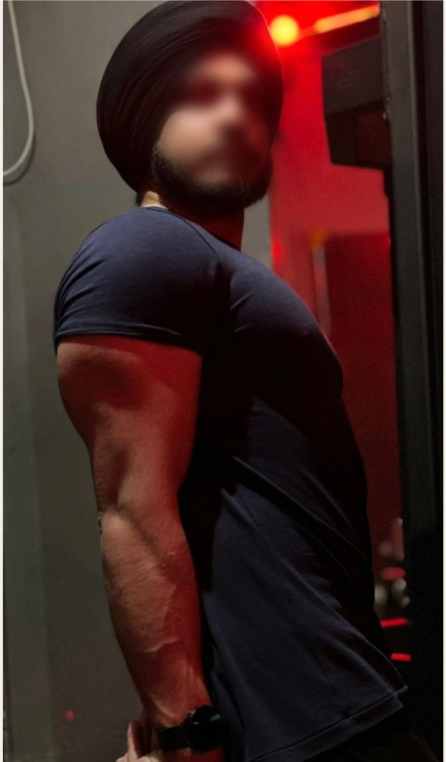 After photo from a client fitness transformation, face softly blurred for privacy