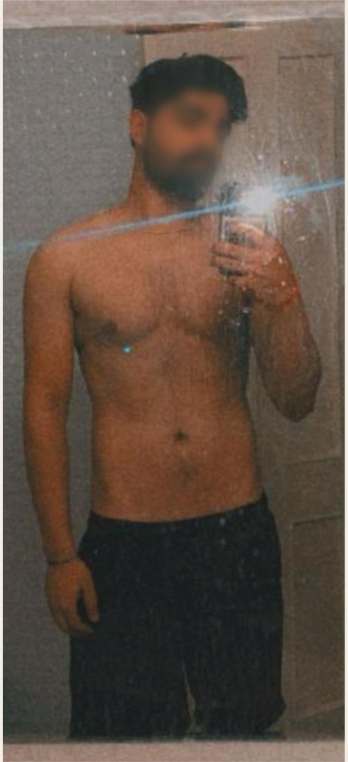 Before photo from a client fitness transformation, face softly blurred for privacy