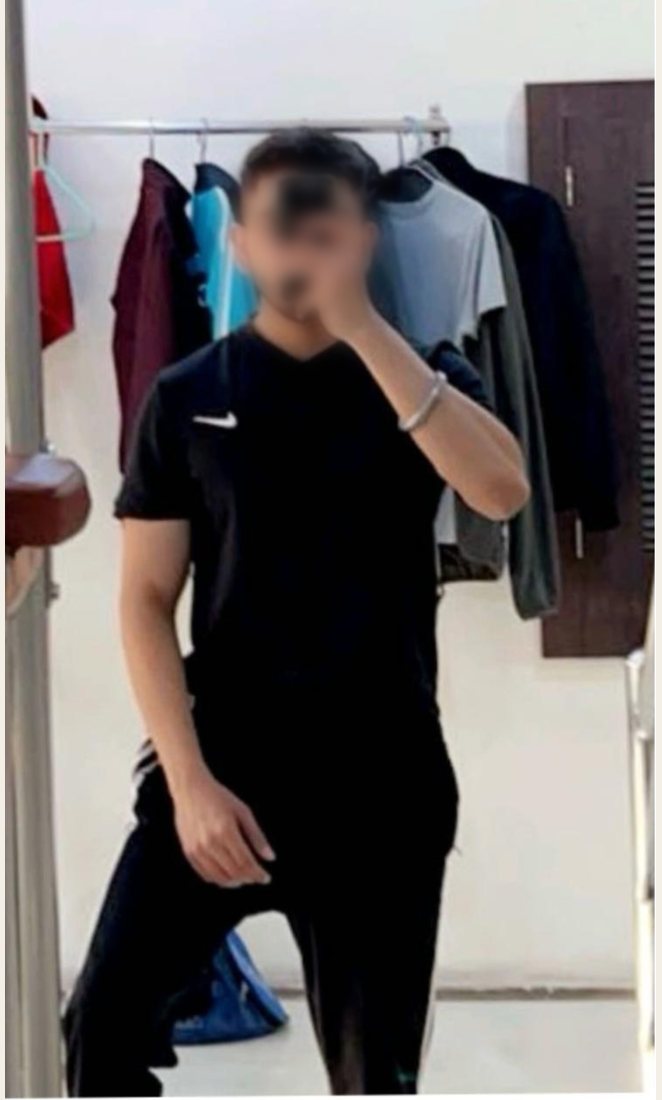 Before photo from a client fitness transformation, face softly blurred for privacy